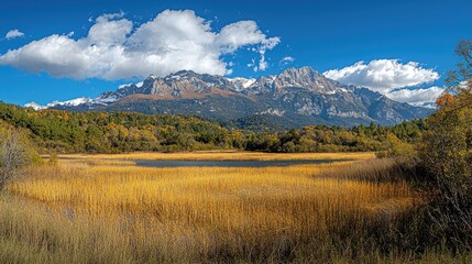 Autumnal landscape with a mountain range and a lake.