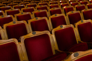 Fototapeta premium Row of red seats in theatre