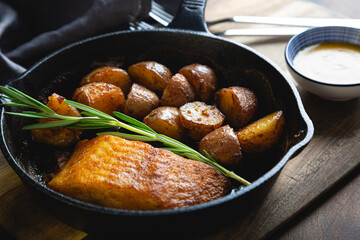 Baked fish with potatoes and rosemary