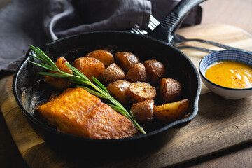 Baked fish with potatoes and rosemary