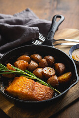 Baked fish with potatoes and rosemary