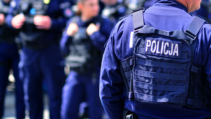 Police sign - logo on the back of the police uniform. Policja