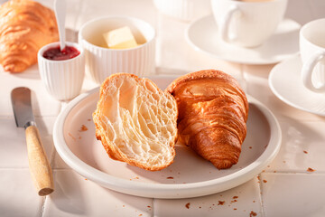 Hot and tasty french croissants in summer morning.