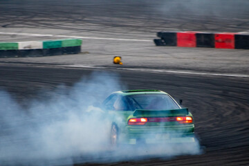 Green drift car on a closed track