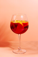 A glass of fruity red cocktail. A refreshing summer drink.