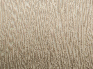 Textured wall surface featuring subtle patterns and a warm beige color perfect for interior design inspiration