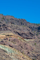 Gran Canaria, Canary Islands, Spain: details of Los Azulejos De Veneguera (Rainbow Rocks), a real geology open air museum along the scenic road from La Aldea de San Nicolas to Mogan. Mountain, erosion