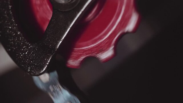 Macro shot of bike derailleur pulley gear.
