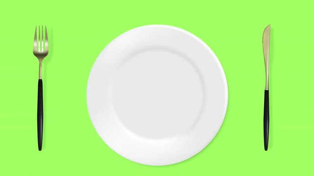 Empty plate with knife and fork on green, white, black background.
