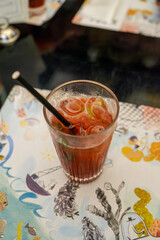 Refreshing strawberry-basil lemonade served chilled, combining fruity sweetness with herbal aroma.