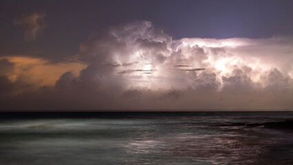 lightning over sea in the night