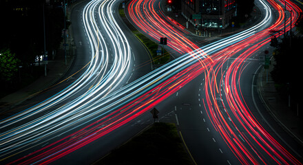 Long exposure of car light trails at night on a highway.
