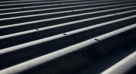 Close up of corrugated metal roof with shadow lines.