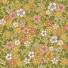 Retro floral pattern in small decorative flowers. Small pink, yellow and white flowers. Light green background. Ditsy print. Floral seamless background ditsy pattern in small cute spring flowers.
