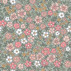 Beautiful floral pattern in small flowers. Small pastel multicolor flowers. Gray blue background. Ditsy print. Floral seamless background. Gentle template for fashion prints. Stock pattern.