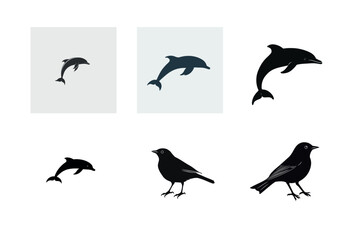Naklejka premium Dolphin and bird silhouettes design elements