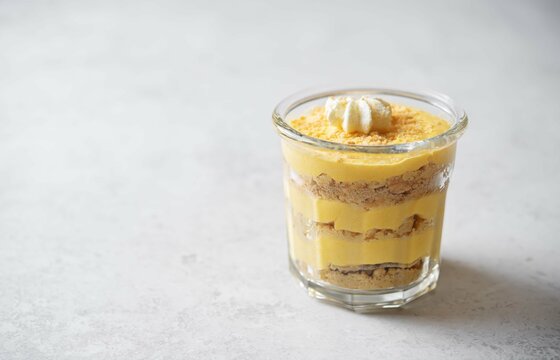 Pumpkin parfait in a glass with whipped cream topping