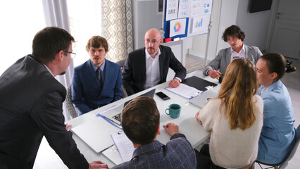The concept of discussing the terms of cooperation and business development of the company. Young professionals