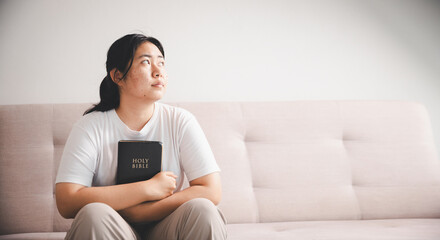 People and hope concept. Close up face female looking up feeling hope and faith. Woman praying....