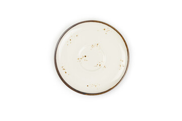 Top view, Beige round ceramic plate with brown dots and rim isolated on a white background. Template for food design, and banner. Use for home or restaurant..