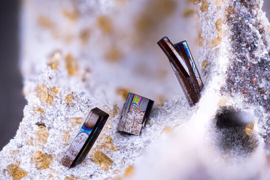 Dark Pseudobrookite crystals with yellow Enstatite. Specimen from Rochessauve. Ard&egrave;che. France. Micro photography extreme close-up. microscope mineral crystal photography for Scientific use.