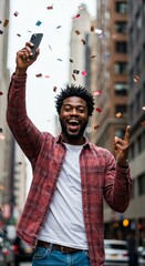 Man in City Celebrates with Confetti Holding Mobile Phone Winning