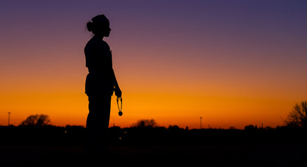 Silhouette of a Healthcare Professional at Sunset A Moment of Reflection