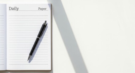 Fototapeta premium Simple Daily Planner Blank Lined Notebook and Pen on White Desk