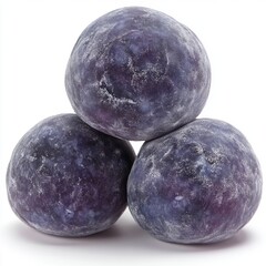 Obraz premium Close-up of three ripe purple plums with a natural textured skin isolated on a white background for healthy fruit or organic produce advertisement