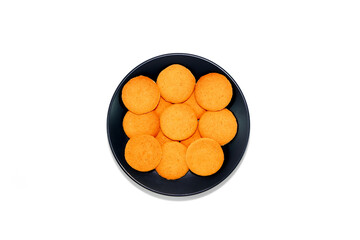 Some of biscuits layering together on ceramic  plate with white background close-up view 