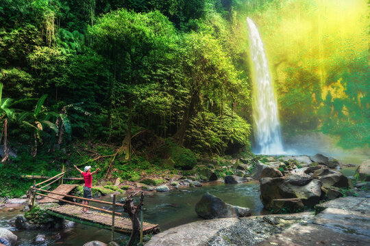 Bali waterfall Air Terjun Nungnung breathtaking 50-meter waterfall Bali famous landmark popular travel destinations Bali, Indonesia