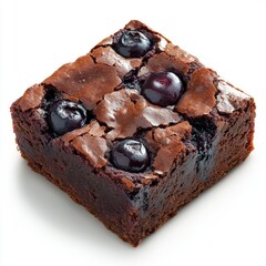 Close-up of a delicious homemade chocolate brownie topped with fresh blueberries and cracked chocolate surface on a plain white background