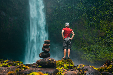 Bali waterfall Air Terjun Nungnung breathtaking 50-meter waterfall in Bali famous landmark and popular travel destinations Bali, Indonesia