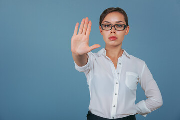 Serious Business Woman Gesturing Stop, Showing Palm. Aspirational Concept for Business...
