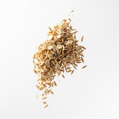 Pile of raw oats floating in mid air on a solid white background