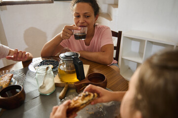 Friends Enjoying a Relaxing Breakfast With Coffee and Pastries Together