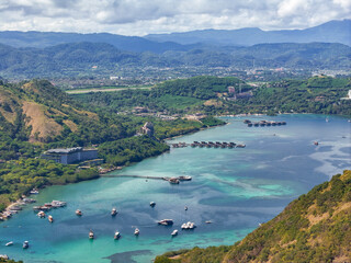 Labuan Bajo, Indonesia - 28 May 2025: Seaside row of luxury beachfront resorts in Labuan Bajo,...