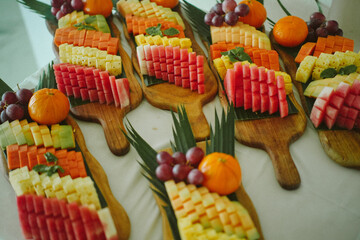 Elegant fruit platter with tropical sliced fruits, arranged for luxury hotel breakfast or catering service