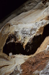 Inside of beautiful old dark cave with many stalactites. Grotte di Is Zuddas, Italy, Sardinia