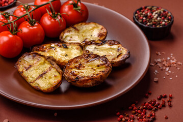 Food, potatoes cut in halves or slices grilled. Cooked baked potatoes