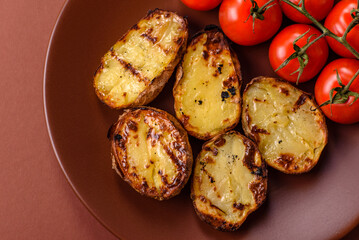 Food, potatoes cut in halves or slices grilled. Cooked baked potatoes
