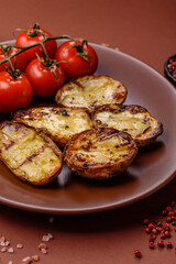 Food, potatoes cut in halves or slices grilled. Cooked baked potatoes