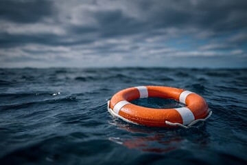 Orange and white life preserver floating on the ocean, with dark blue water
