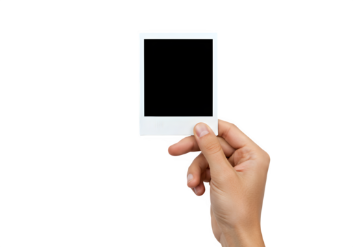 A hand holds a polaroid blank picture, isolated on white or transparent background. PNG