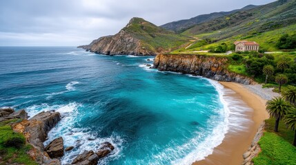 Obraz premium Stunning Coastal Scene Turquoise Ocean Waves Crashing on a Secluded Sandy Beach near a Historic Building