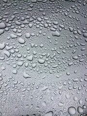 irregular water drops on gray metal surface, allover pattern