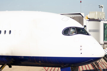 Commercial airplane loading luggage