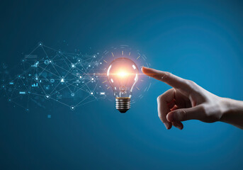 Innovative ideas and technology concept with light bulb and hand touching for creative solutions
