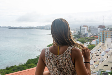 Woman in front of the Caribbean sea in Margarita Island, Venezuela