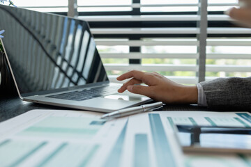 a female employee is working in an office, a businesswoman is handling urgent financial matters, a...